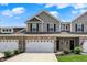 Well-maintained townhome with a brick and vinyl facade at 6463 Wasco Dr, Whitestown, IN 46075