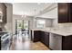 Stylish kitchen featuring stainless steel appliances, granite countertops, and dark wood cabinets at 6463 Wasco Dr, Whitestown, IN 46075