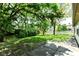 Lush backyard with well-maintained lawn, mature trees, and privacy, perfect for outdoor activities and relaxation at 6471 Hunters Green Pl, Indianapolis, IN 46278