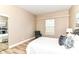 Bright bedroom features wood floors, a large window and a closet with mirrored sliding doors at 6471 Hunters Green Pl, Indianapolis, IN 46278