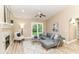 Charming living room featuring a fireplace, vaulted ceiling and access to outdoor patio at 6471 Hunters Green Pl, Indianapolis, IN 46278
