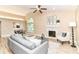 Bright living room with a dining area, modern furniture, fireplace and vaulted ceiling at 6471 Hunters Green Pl, Indianapolis, IN 46278