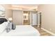 Spacious main bedroom with a luxurious bed, ensuite bathroom access, and a relaxing atmosphere at 6471 Hunters Green Pl, Indianapolis, IN 46278