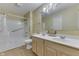 Traditional bathroom featuring double vanity and combined tub and shower at 6542 E Edna Mills Dr, Camby, IN 46113