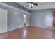 Bedroom features hardwood floors, a ceiling fan, and large windows at 6542 E Edna Mills Dr, Camby, IN 46113