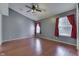 Empty bedroom features wood floors, a ceiling fan, and large windows at 6542 E Edna Mills Dr, Camby, IN 46113