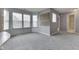 Carpeted bedroom featuring neutral walls and an open doorway to an ensuite bathroom at 6542 E Edna Mills Dr, Camby, IN 46113