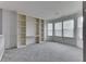 Bonus room with carpet flooring, built-in shelving and many windows at 6542 E Edna Mills Dr, Camby, IN 46113