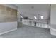 Bonus room with carpet flooring, built-in shelving and railing overlooking the lower level at 6542 E Edna Mills Dr, Camby, IN 46113