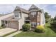 Two-story home featuring brick and vinyl siding, with an attached garage and manicured front lawn at 6542 E Edna Mills Dr, Camby, IN 46113