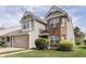 Attractive two-story home with a brick and vinyl exterior, an attached garage, and neatly trimmed bushes at 6542 E Edna Mills Dr, Camby, IN 46113