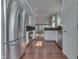 Updated kitchen features stainless steel appliances, white cabinets, and hardwood floors at 6542 E Edna Mills Dr, Camby, IN 46113