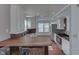 Bright kitchen with modern cabinets, hardwood floors, and an island with barstool seating at 6542 E Edna Mills Dr, Camby, IN 46113