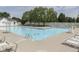 Community pool with ladders and lounge chairs for relaxation and recreation at 6542 E Edna Mills Dr, Camby, IN 46113