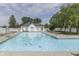 Beautiful community pool with lounge chairs and tables for residents to enjoy on sunny days at 6542 E Edna Mills Dr, Camby, IN 46113
