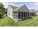 Exterior view of a home featuring a screened-in porch and manicured lawn at 6542 E Edna Mills Dr, Camby, IN 46113