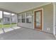 Relaxing screened porch offers seamless indoor-outdoor living and enjoyment at 6542 E Edna Mills Dr, Camby, IN 46113