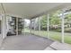 Open screened-in porch offering scenic views of the property's lush yard at 6542 E Edna Mills Dr, Camby, IN 46113