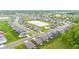 A picturesque aerial view displaying the neighborhood's layout, including a pond and neatly arranged homes at 6609 Dunkirk Dr, McCordsville, IN 46055