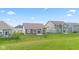 Expansive backyard with green lawn, patio area, perfect for outdoor entertaining at 6609 Dunkirk Dr, McCordsville, IN 46055