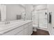 Clean, well-lit bathroom featuring a double vanity and glass-enclosed shower at 6609 Dunkirk Dr, McCordsville, IN 46055