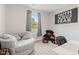 Comfortable bedroom with natural light, a cozy chair, and unique decor at 6609 Dunkirk Dr, McCordsville, IN 46055