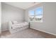 Neutral bedroom with a daybed and drawers underneath, with a large window at 6609 Dunkirk Dr, McCordsville, IN 46055