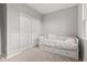 Neutral bedroom with a daybed and drawers underneath, and a closet at 6609 Dunkirk Dr, McCordsville, IN 46055