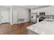 Bright kitchen featuring stainless steel appliances, white countertops, and hardwood flooring at 6609 Dunkirk Dr, McCordsville, IN 46055