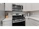 Close up of the gas range oven in a modern kitchen, featuring stainless steel at 6609 Dunkirk Dr, McCordsville, IN 46055