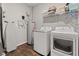 Functional laundry room with modern washer, dryer, and water heater at 6609 Dunkirk Dr, McCordsville, IN 46055