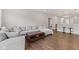 Bright living room showcasing a large sectional sofa, coffee table, and modern decor at 6609 Dunkirk Dr, McCordsville, IN 46055