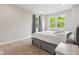Comfortable main bedroom with large windows offering great outdoor views and natural light at 6609 Dunkirk Dr, McCordsville, IN 46055