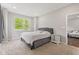 Cozy main bedroom with a large window, soft carpet, and tasteful decor at 6609 Dunkirk Dr, McCordsville, IN 46055