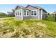 Backyard featuring a lawn, fence, and glass enclosed sunroom at 6847 Cardiff Dr, McCordsville, IN 46055