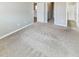 Carpeted bedroom showcasing multiple entryways to other parts of the home at 6847 Cardiff Dr, McCordsville, IN 46055
