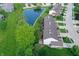 Aerial view of townhomes along scenic pond and lush lawns at 7155 Sea Pine Dr, Indianapolis, IN 46250