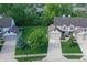 Aerial view of townhome with green lawn, mature trees and private backyard space at 7155 Sea Pine Dr, Indianapolis, IN 46250