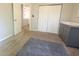 Bright Bedroom featuring neutral paint, closet, dresser and a door into the hallway at 7155 Sea Pine Dr, Indianapolis, IN 46250