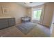 Charming Bedroom with a gray crib, dresser, and a bright window, perfect for a peaceful space at 7155 Sea Pine Dr, Indianapolis, IN 46250