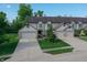 Charming townhome exterior with well-manicured lawn and attached one car garage at 7155 Sea Pine Dr, Indianapolis, IN 46250