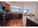 Spacious kitchen with wood flooring, ample counter space, and a view into the living area at 7155 Sea Pine Dr, Indianapolis, IN 46250