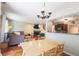 Open concept living room with a fireplace, hardwood floors, and a seamless transition to the kitchen at 7155 Sea Pine Dr, Indianapolis, IN 46250