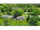 Aerial view of the property showcasing the landscaped yard, surrounding neighborhood, and lush greenery at 7316 Lesley Ave, Indianapolis, IN 46250