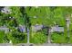 This aerial view showcases the property's landscaping, neighboring homes, and quiet street at 7316 Lesley Ave, Indianapolis, IN 46250