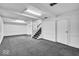 The finished basement offers a versatile space with carpeted floors and white painted walls at 7316 Lesley Ave, Indianapolis, IN 46250