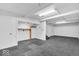 Large basement space featuring a storage closet and access to additional rooms at 7316 Lesley Ave, Indianapolis, IN 46250