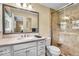 Tidy bathroom with glass shower, large vanity, and classic fixtures at 7316 Lesley Ave, Indianapolis, IN 46250