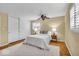 Comfortable bedroom with hardwood floors, ceiling fan and a spacious closet at 7316 Lesley Ave, Indianapolis, IN 46250