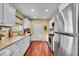 Well-lit kitchen equipped with stainless steel appliances and granite countertops at 7316 Lesley Ave, Indianapolis, IN 46250
